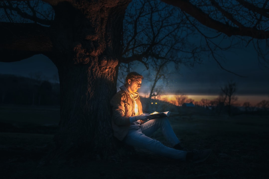 woman-in-white-dress-sitting-on-ground-under-tree-during-night-time-jdtdvf6fdus